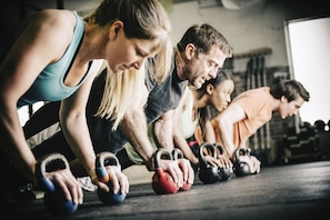Guests can work out in a functional training space with kettlebells and varied equipment.