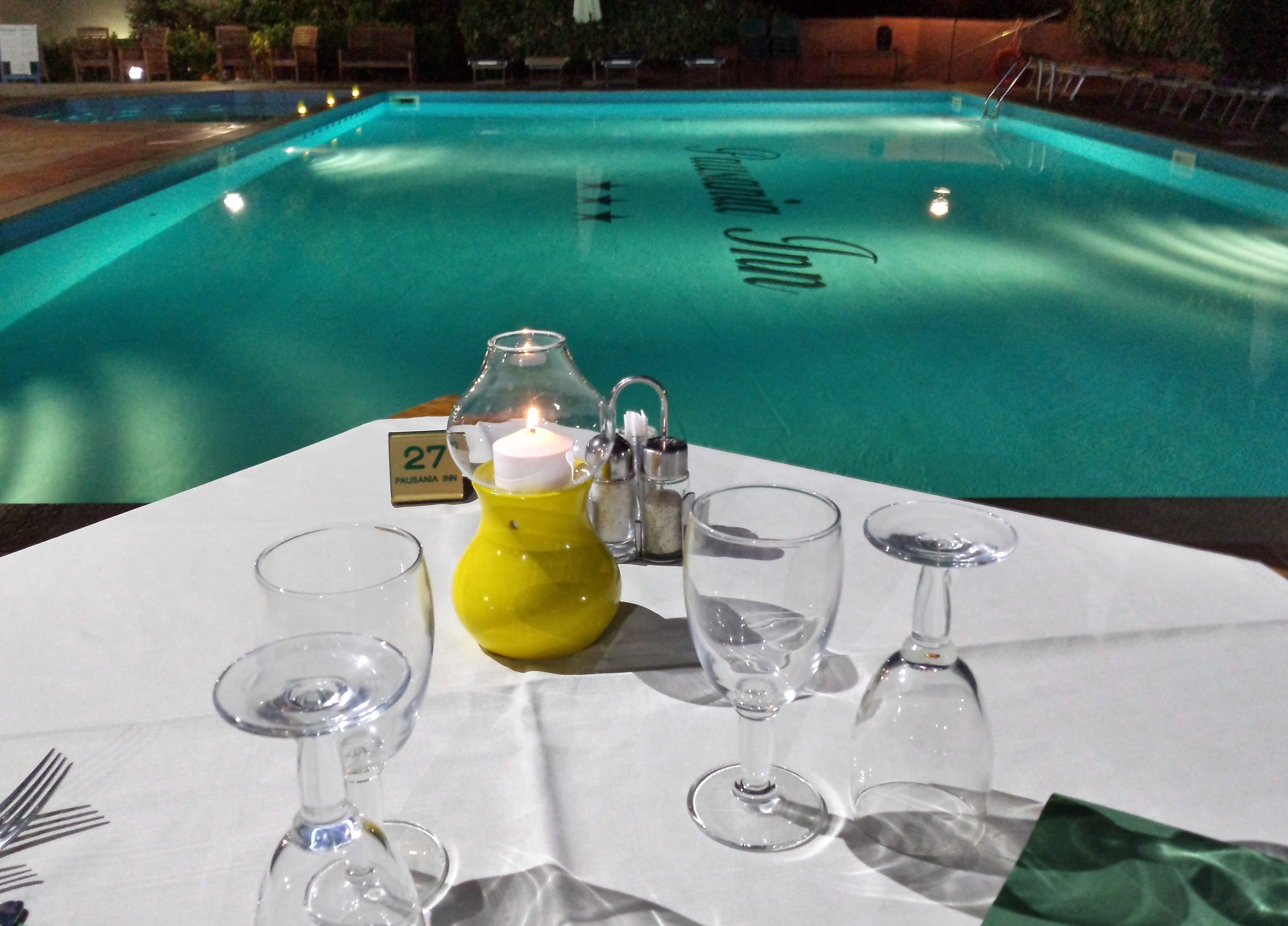 Seasonal outdoor pool, open 9:00 AM to 7:00 PM, pool umbrellas