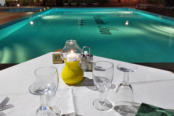 Seasonal outdoor pool, open 9:00 AM to 7:00 PM, pool umbrellas