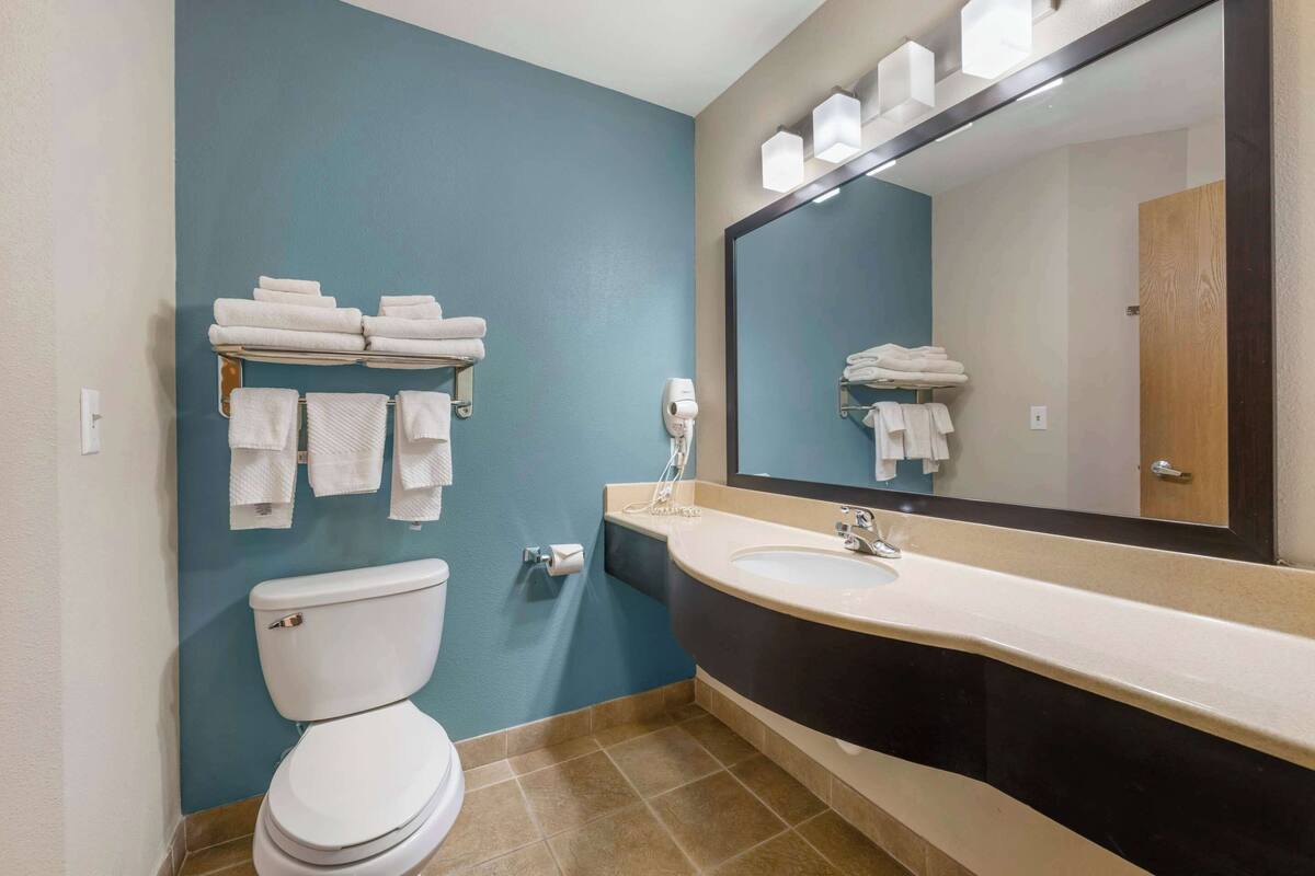 premium bedding, desk, blackout curtains, iron/ironing board