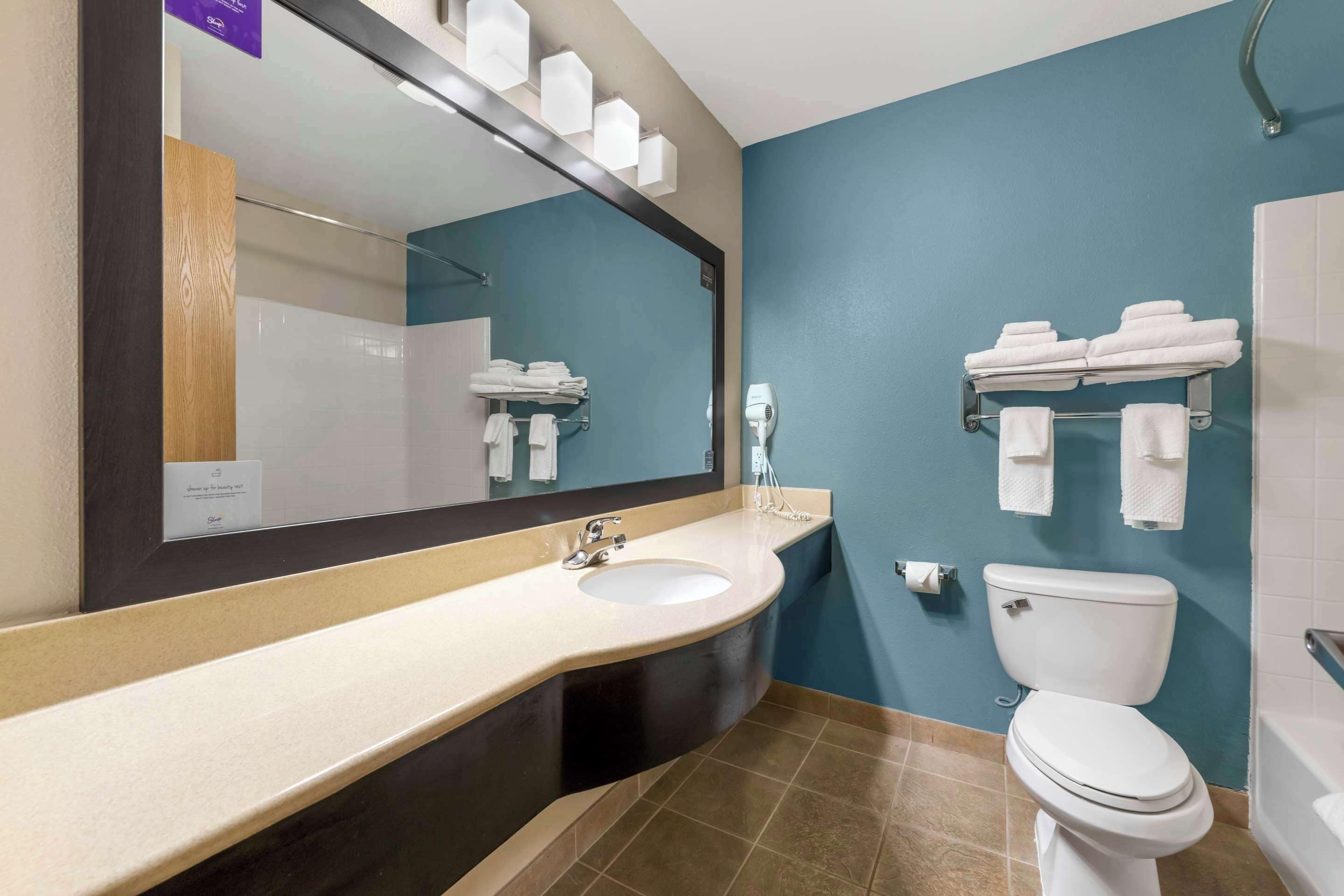 premium bedding, desk, blackout curtains, iron/ironing board