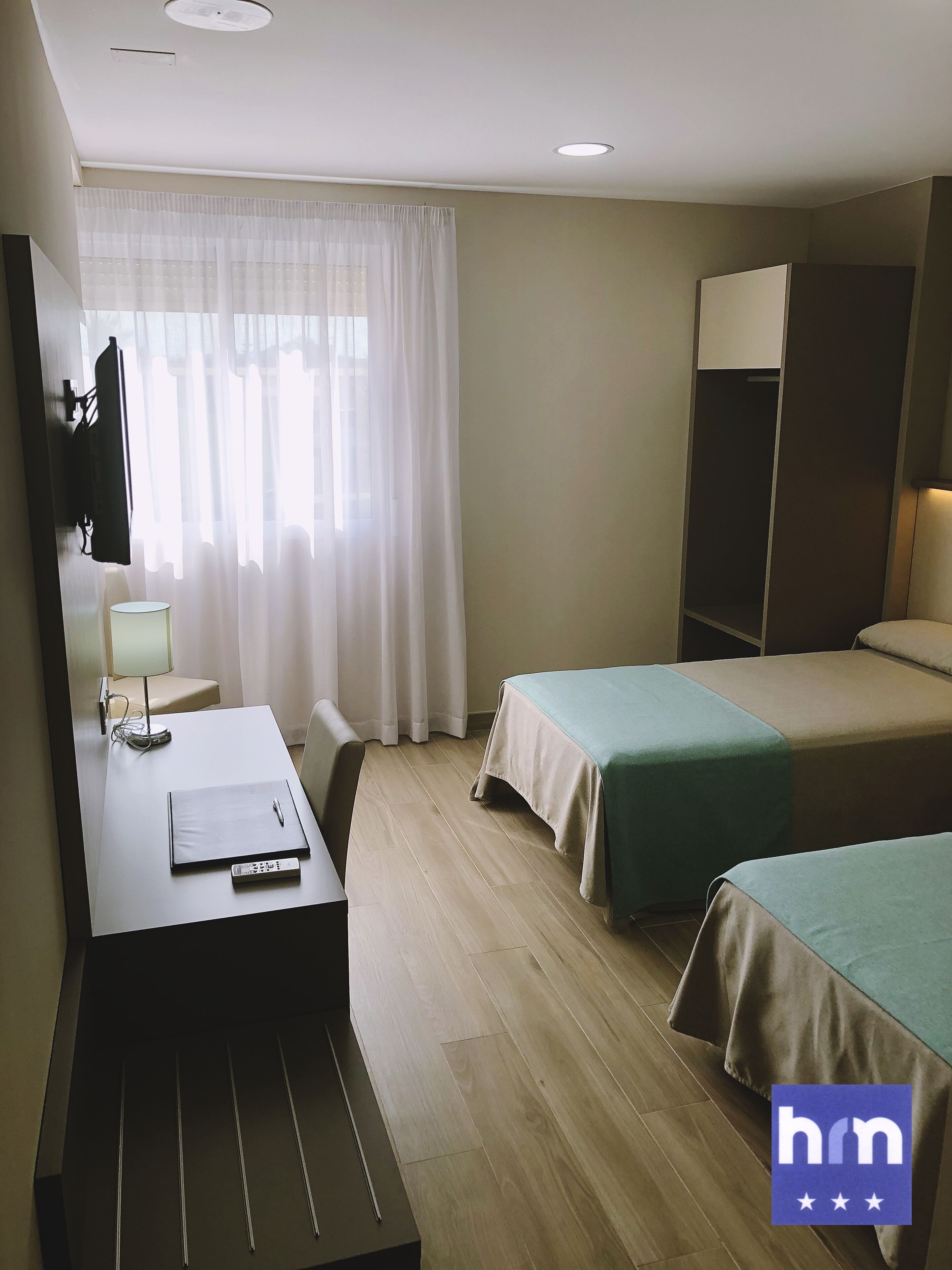 Desk, laptop workspace, free WiFi, bed sheets