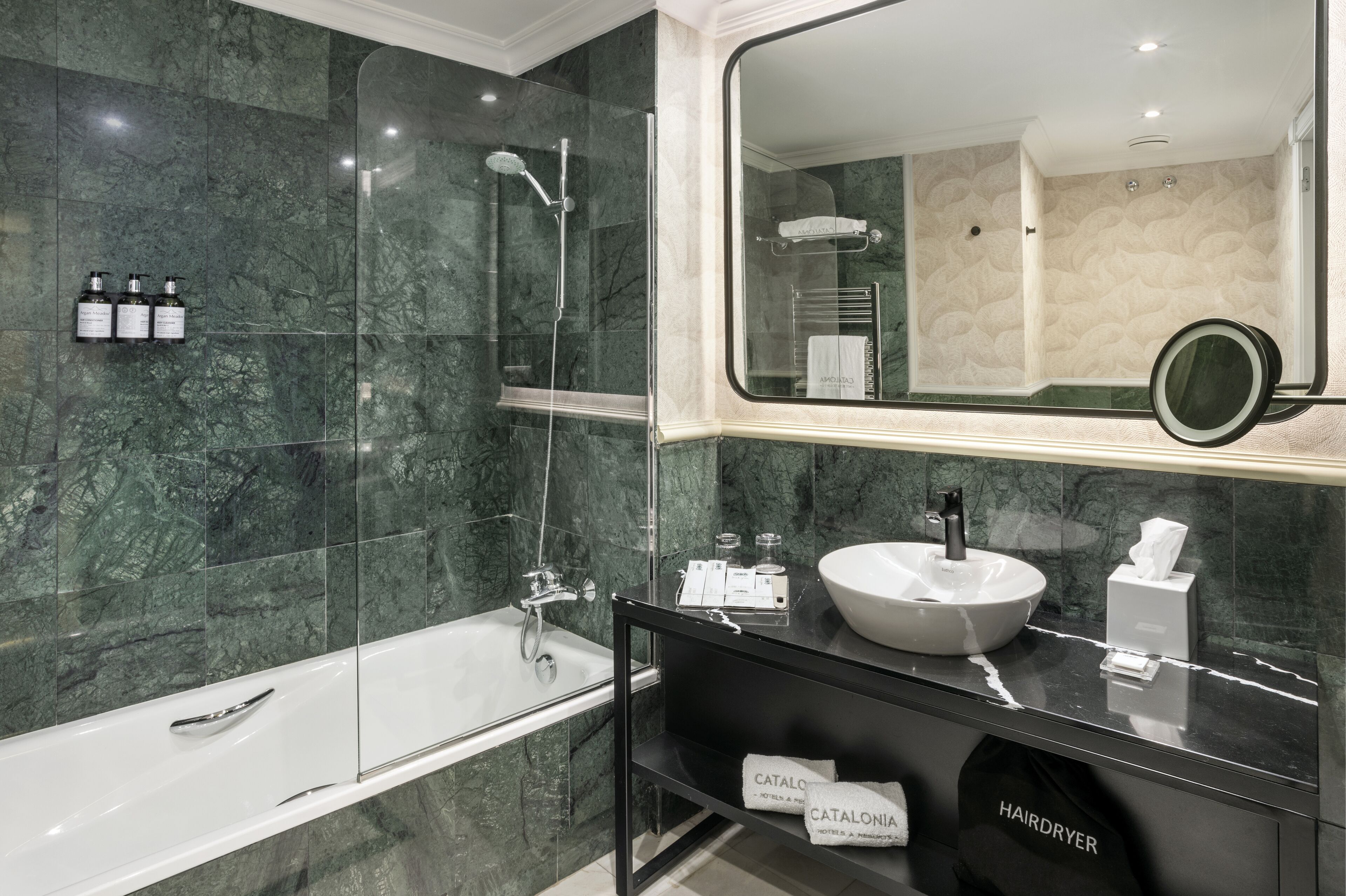 designer toiletries, hair dryer, towels