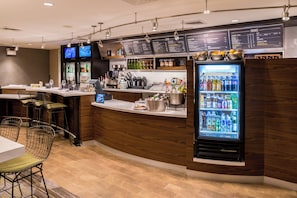 A modern bar area with a counter, seating, and a beverage refrigerator. - Courtyard Thousand Oaks Ventura County (Thousand Oaks)