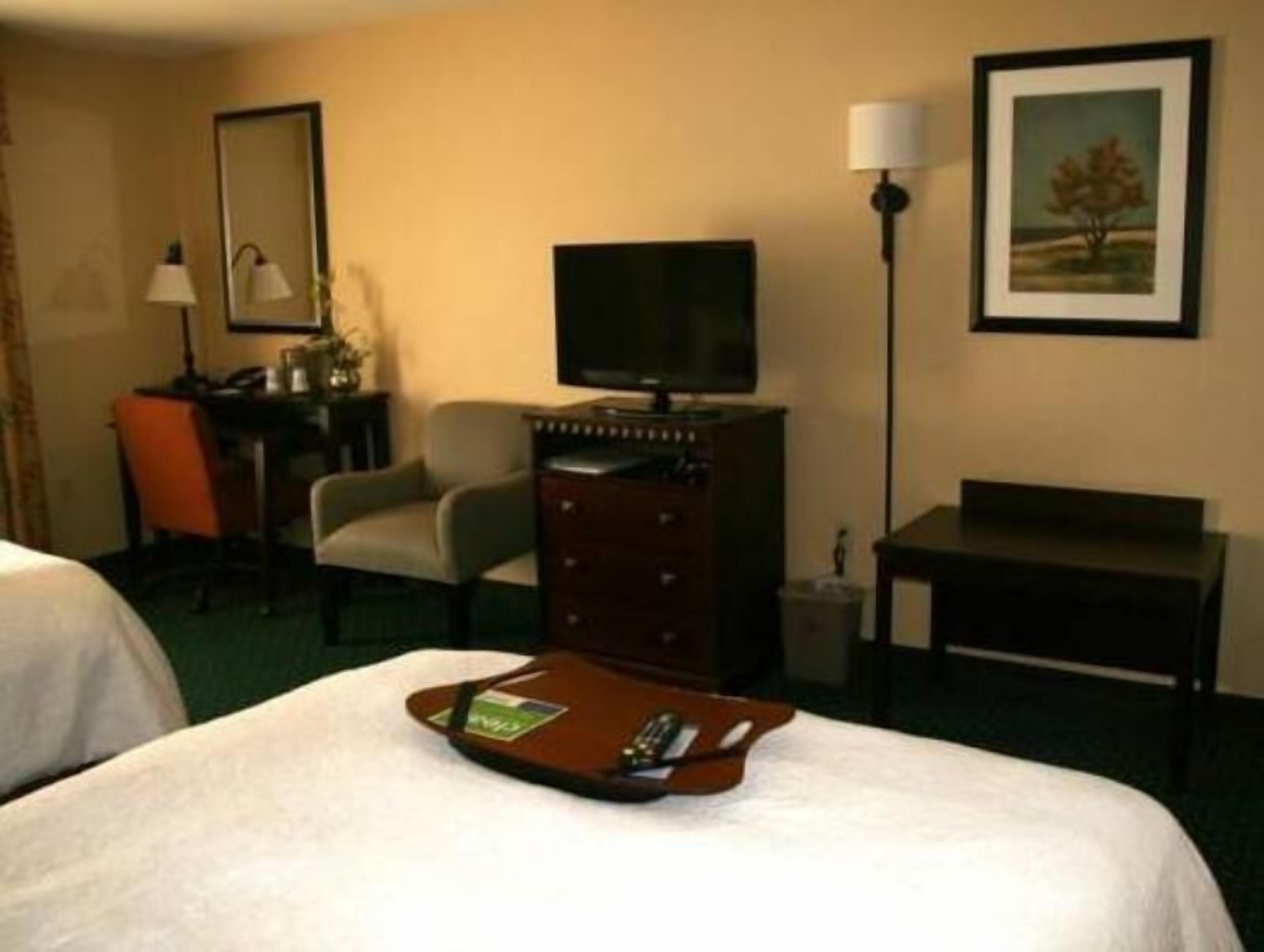 Premium bedding, desk, laptop workspace, blackout drapes