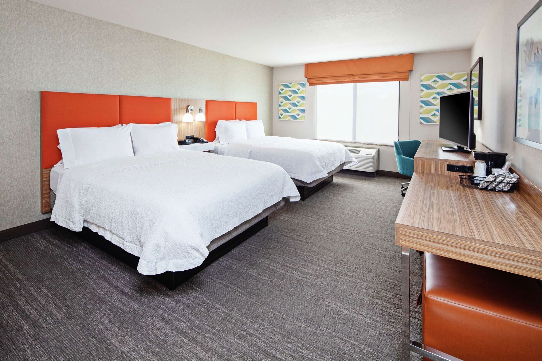 Premium bedding, desk, laptop workspace, blackout drapes