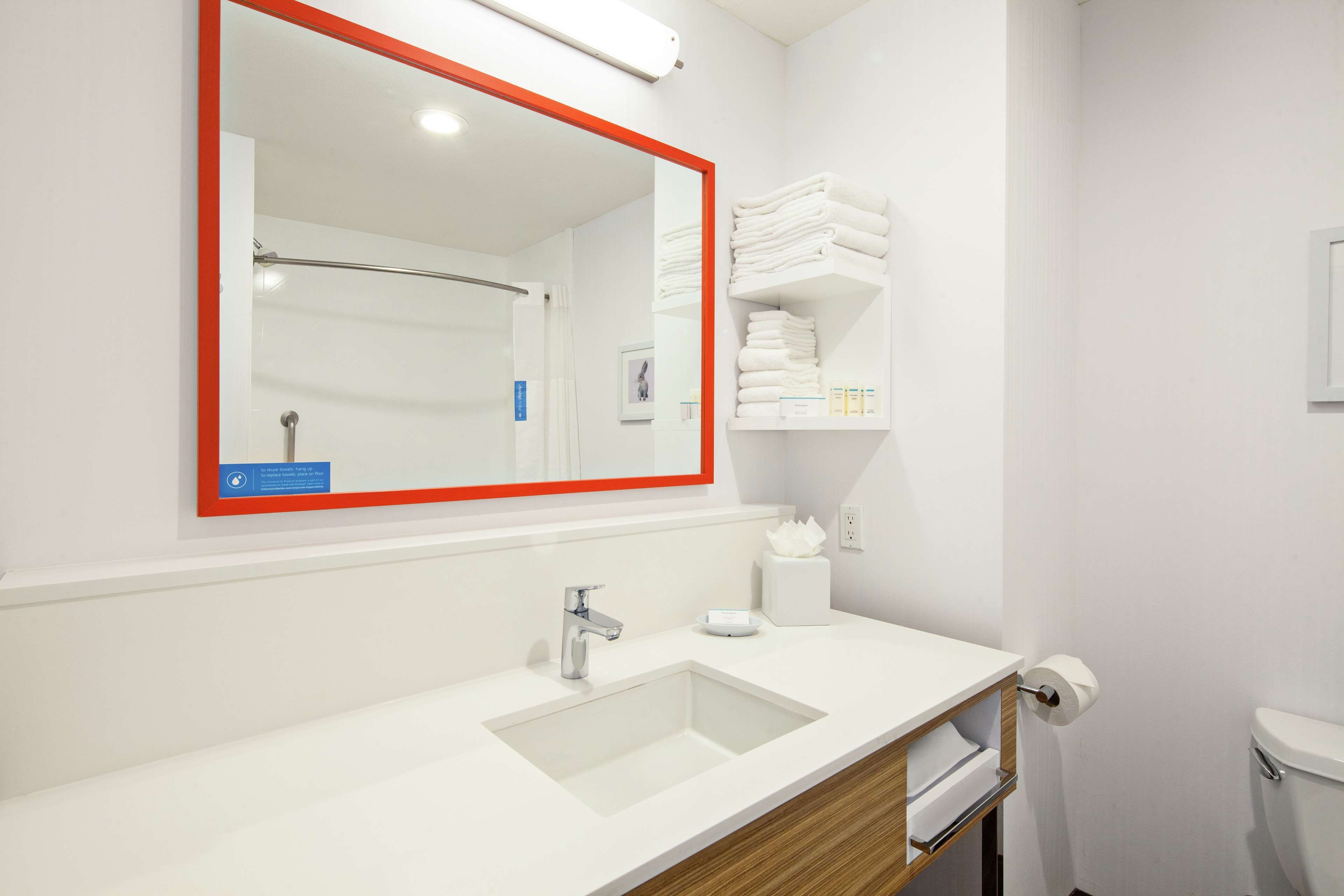 standard room with two queen beds | bathroom | hydromassage showerhead, free toiletries, hair dryer, towels