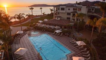 Outdoor pool, open 8:00 AM to 10:00 PM, pool umbrellas