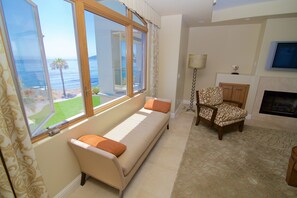 Penthouse, Oceanfront | Living area | 36-inch flat-screen TV with cable channels, TV, DVD player