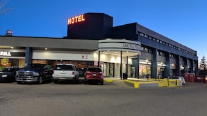 A hotel with a prominent 'HOTEL' sign, a 'GRILL' sign, and an 'ARGYLL PLAZA' sign. - Argyll Plaza Hotel (Edmonton)
