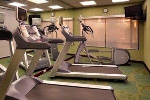Stay active in our well-equipped fitness room, featuring treadmills, a stationary bike, and a rowing machine.