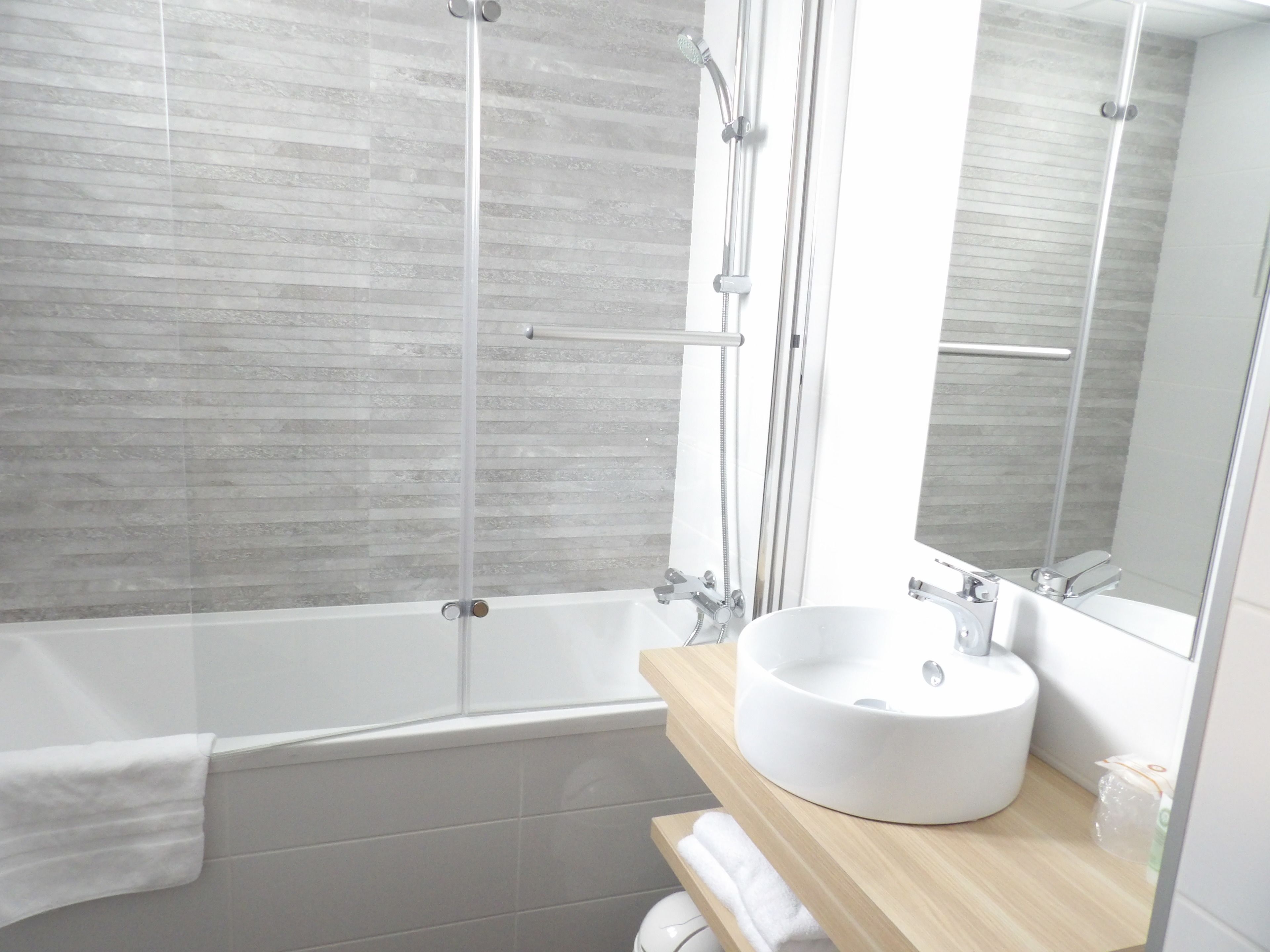 deep-soaking bathtub, free toiletries, hair dryer, towels