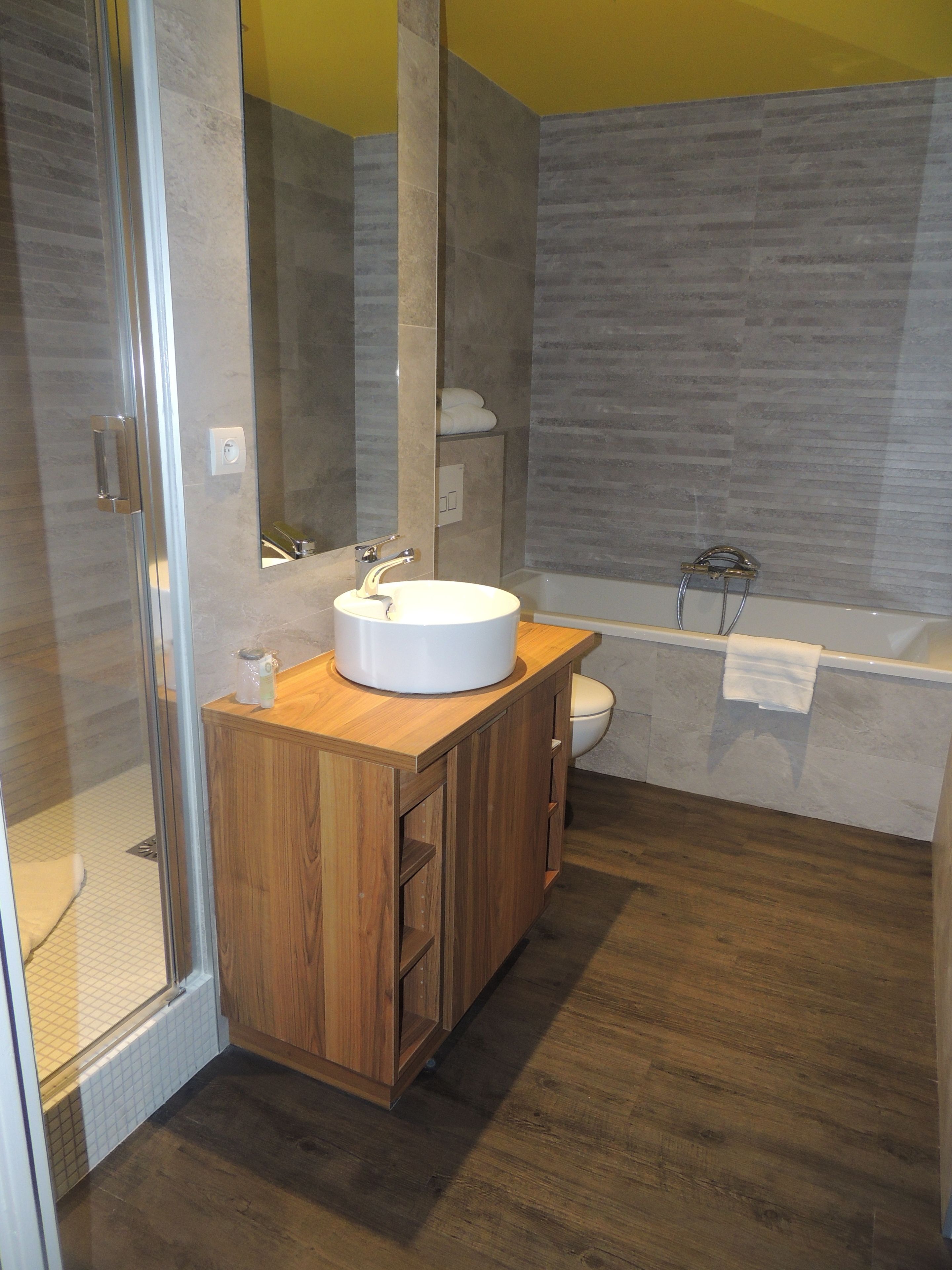 deep-soaking bathtub, free toiletries, hair dryer, towels