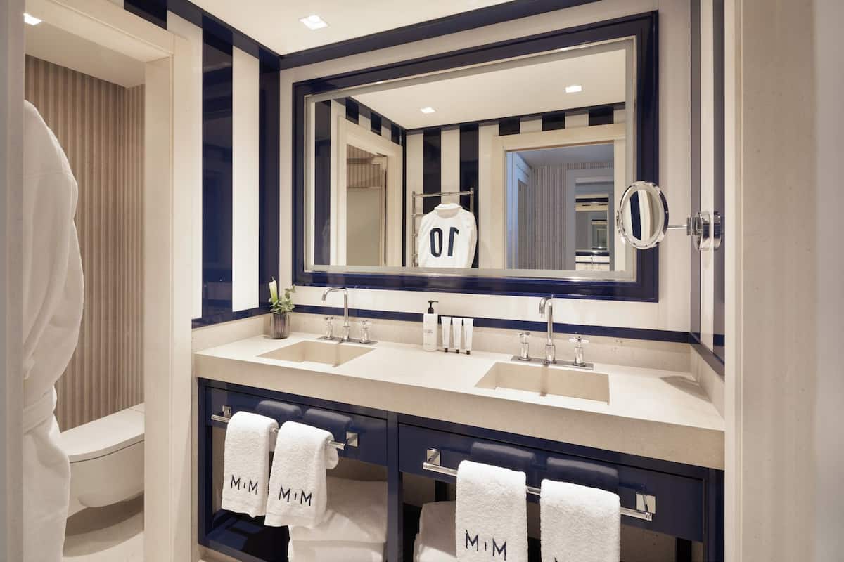 combined shower/bathtub, designer toiletries, hair dryer, bathrobes