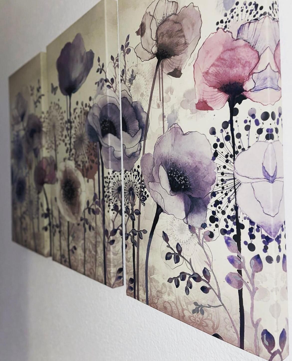A wall with a floral painting featuring various flowers and leaves.