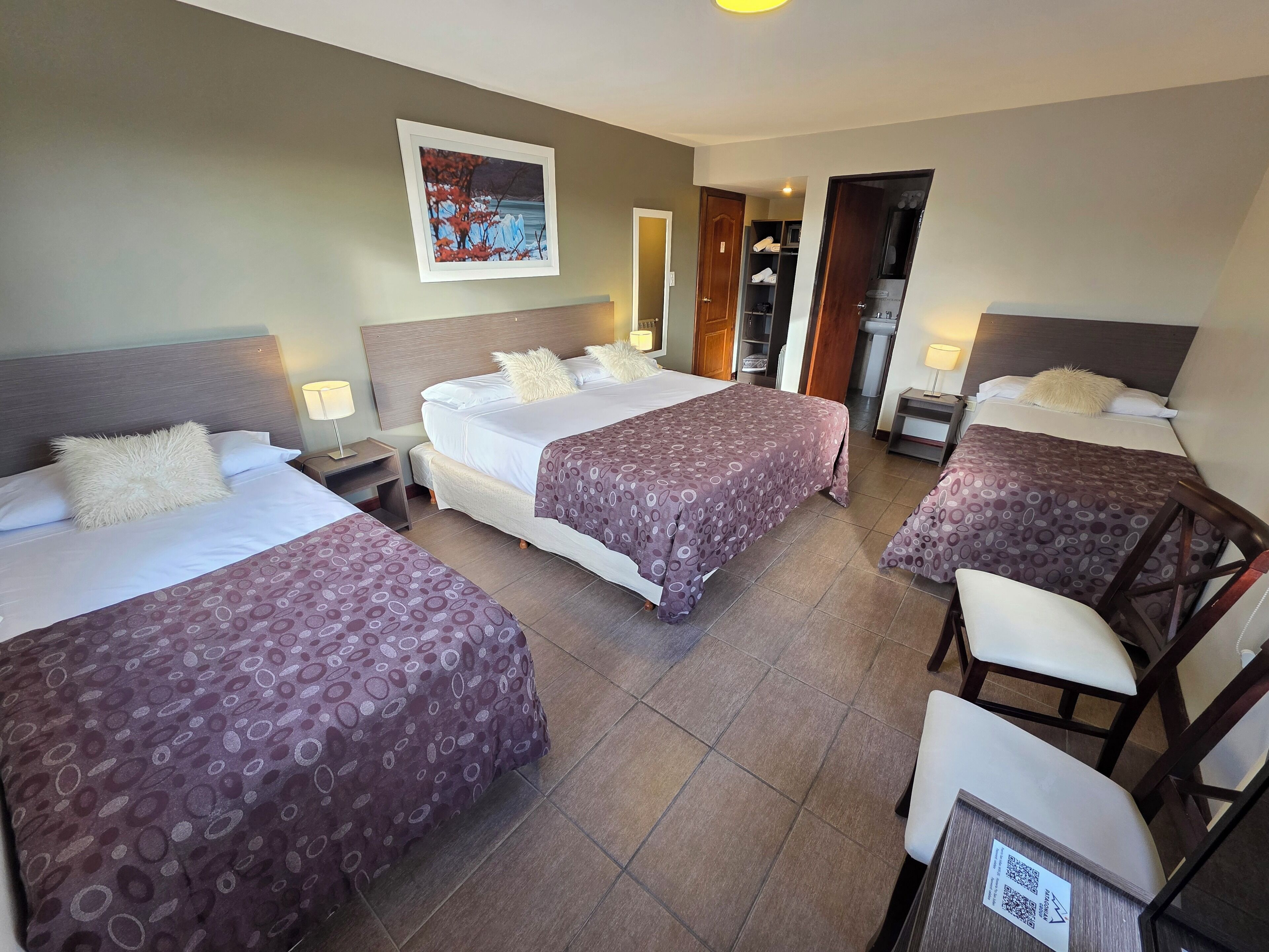 standard quadruple room | minibar, in-room safe, desk, iron/ironing board