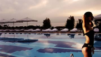 Outdoor pool, open 9 AM to 8:00 PM, pool umbrellas, pool loungers