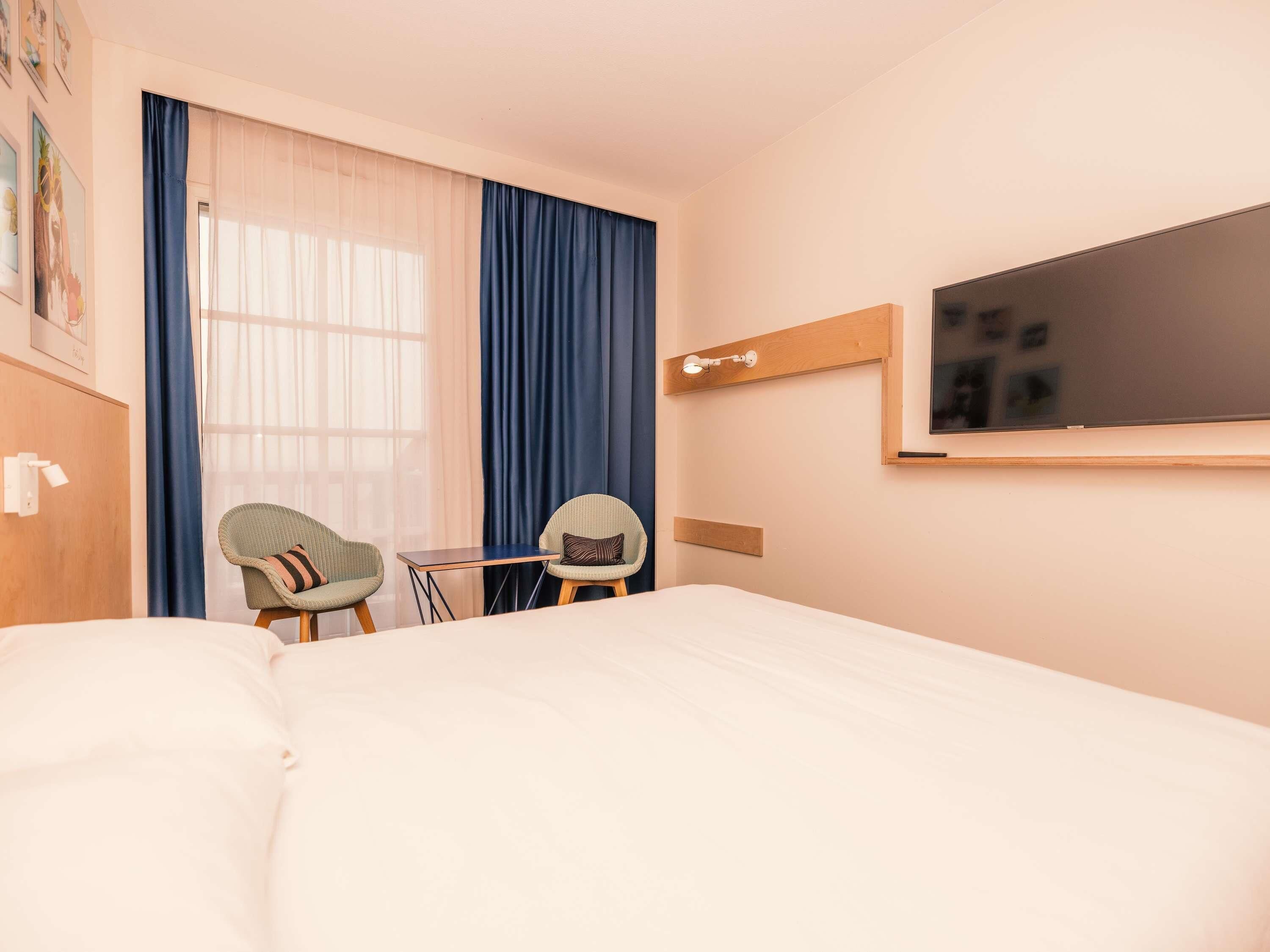 Blackout curtains, soundproofing, iron/ironing board, travel cot