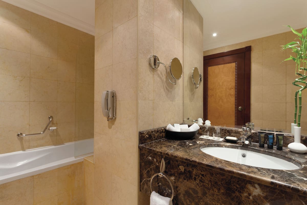 combined shower/bathtub, eco-friendly toiletries, hair dryer, bathrobes