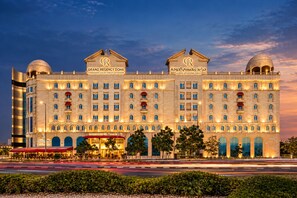A large, multi-story hotel with a prominent 'Grand Regency Doha' sign. - Grand Regency Doha, Trademark Collection by Wyndham (Doha)