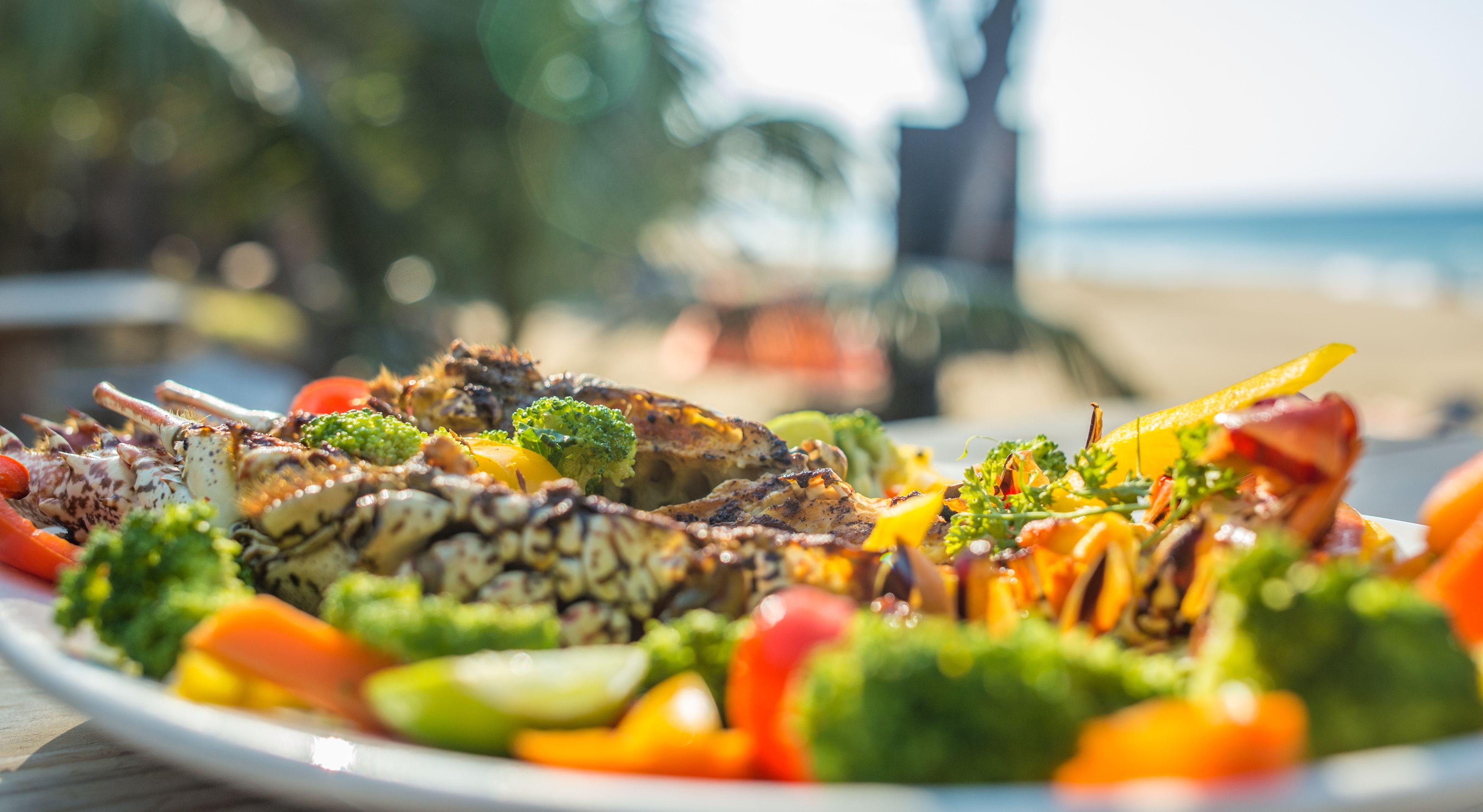 A plate of grilled seafood and vegetables.