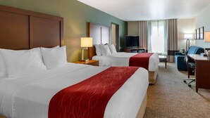 A hotel room with two beds, a desk, a chair, a TV, and a window with curtains. - Comfort Inn & Suites Salem Northeast (Salem)