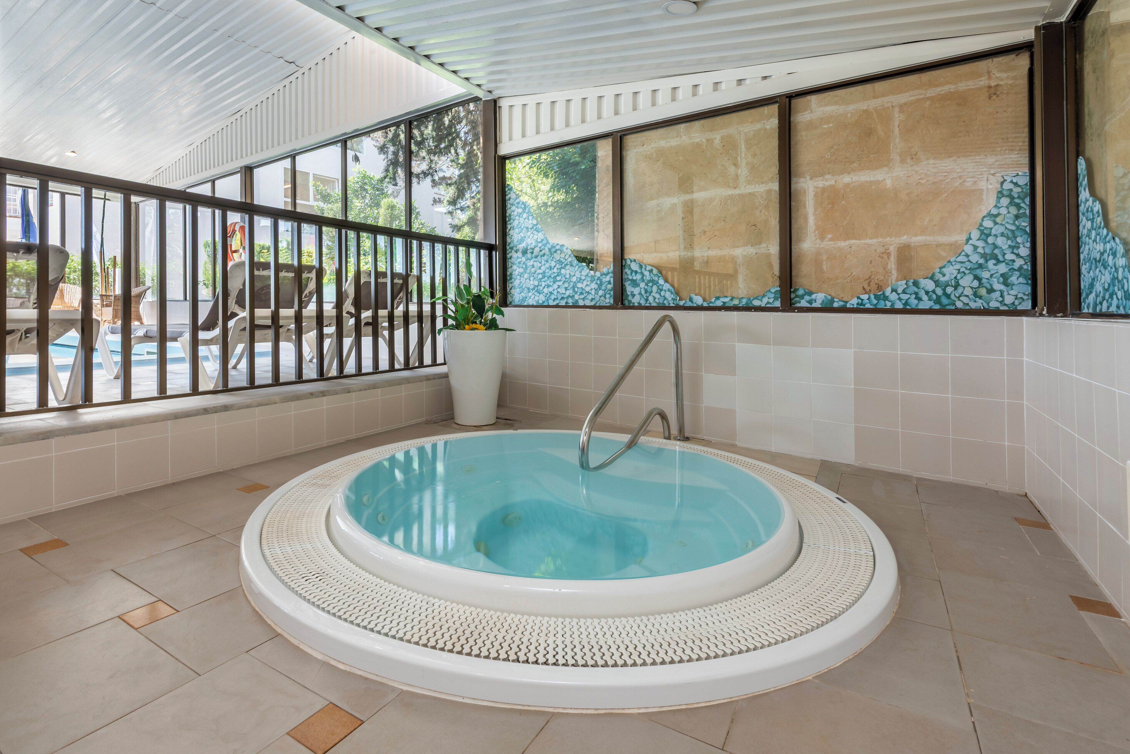 indoor pool, 2 outdoor pools, pool umbrellas, pool loungers