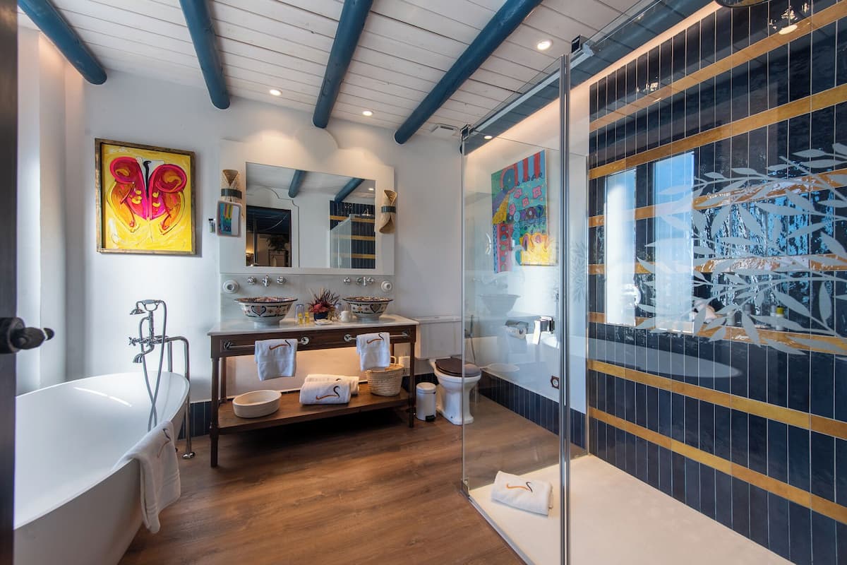 rainfall showerhead, hair dryer, bathrobes, slippers