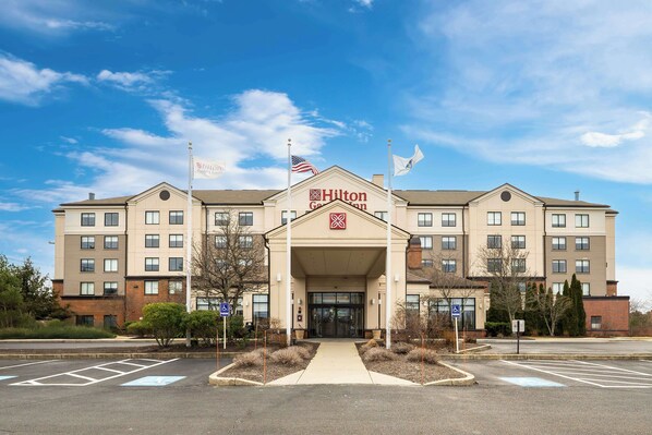 A large, multi-story hotel with a prominent Hilton Garden Inn sign. - Hilton Garden Inn Plymouth (Plymouth)