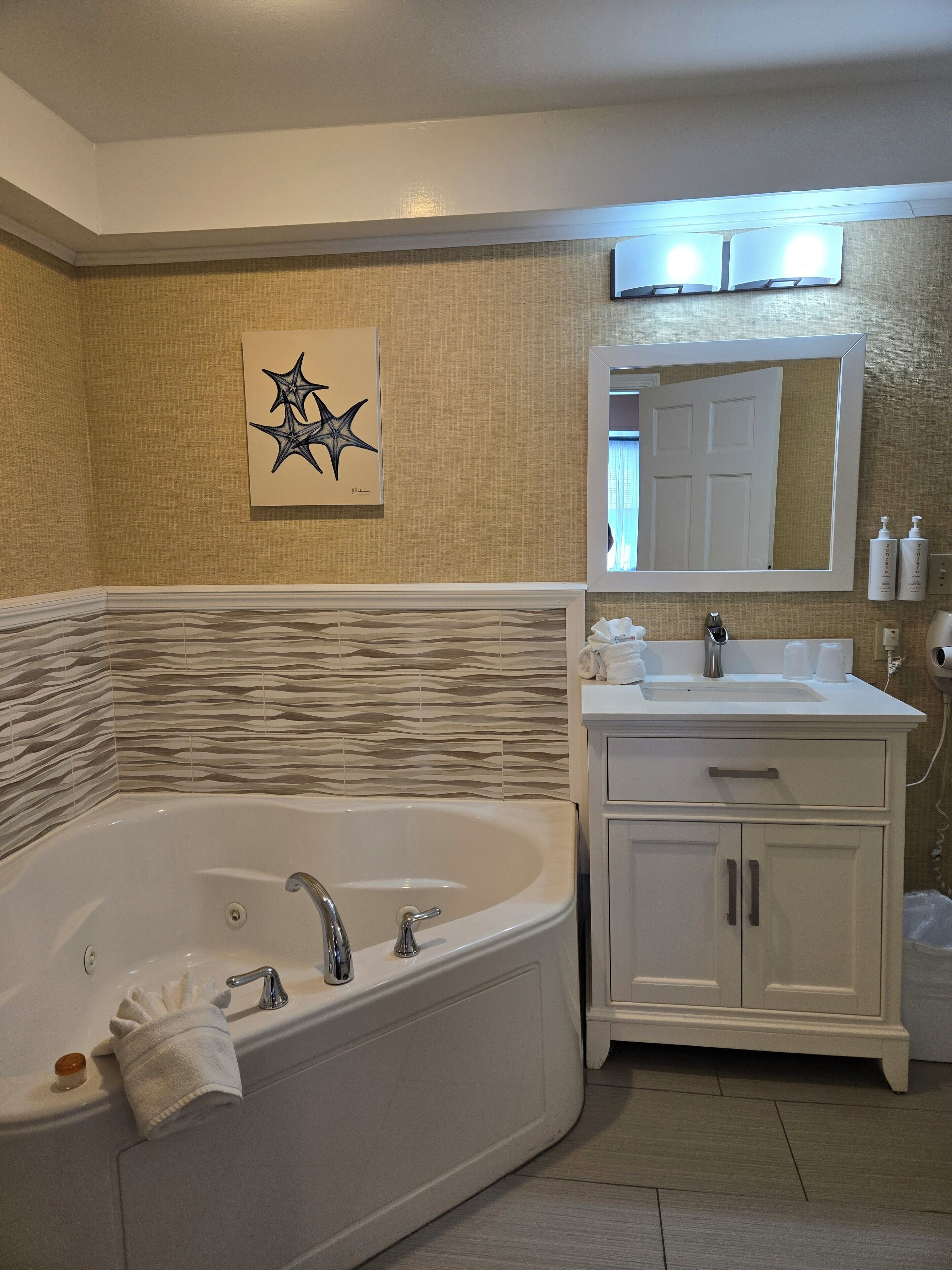 grand room, jetted tub | bathroom | free toiletries, hair dryer, towels, soap