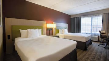 Premium bedding, desk, laptop workspace, blackout drapes