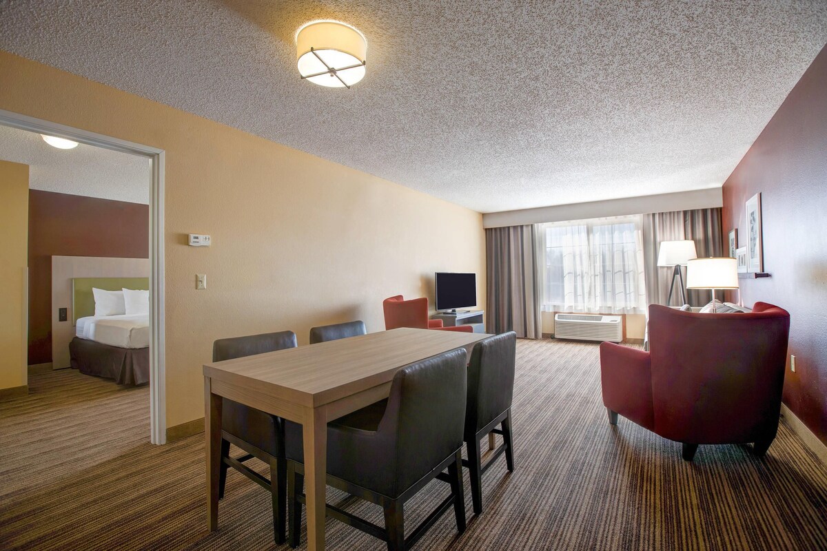 Premium bedding, desk, laptop workspace, blackout curtains