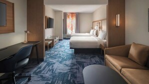 A hotel room with a desk, two beds, a sofa, and a TV. - Fairfield Inn & Suites by Marriott Somerset (Somerset)