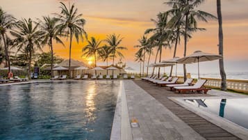 Outdoor pool, open 6 AM to 10 PM, pool umbrellas, sun loungers