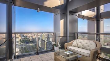 The Level Penthouse Suite | Minibar, in-room safe, desk, blackout curtains