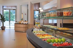 A buffet with various fruits, nuts, and other snacks. - Melia Valencia (Valencia)