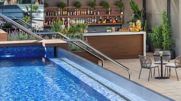 Seasonal outdoor pool, open 8:30 AM to 8:30 PM, pool umbrellas