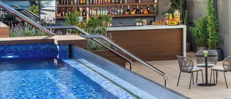 Seasonal outdoor pool, open 8:30 AM to 8:30 PM, pool umbrellas