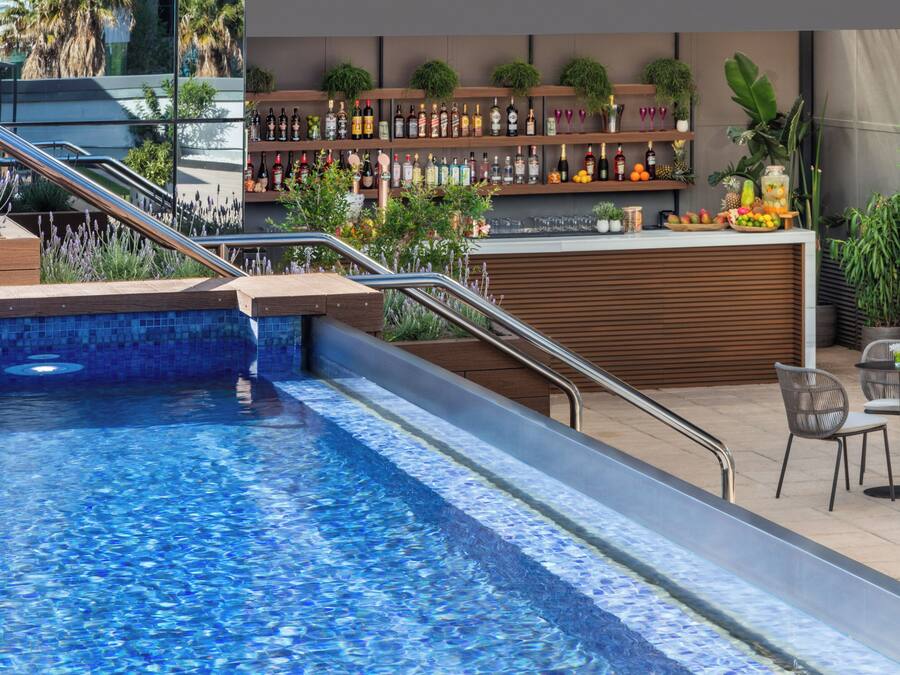 Seasonal outdoor pool, open 8:30 AM to 8:30 PM, pool umbrellas