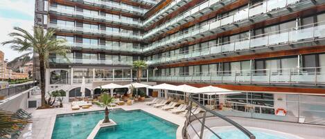 2 outdoor pools, pool umbrellas, pool loungers