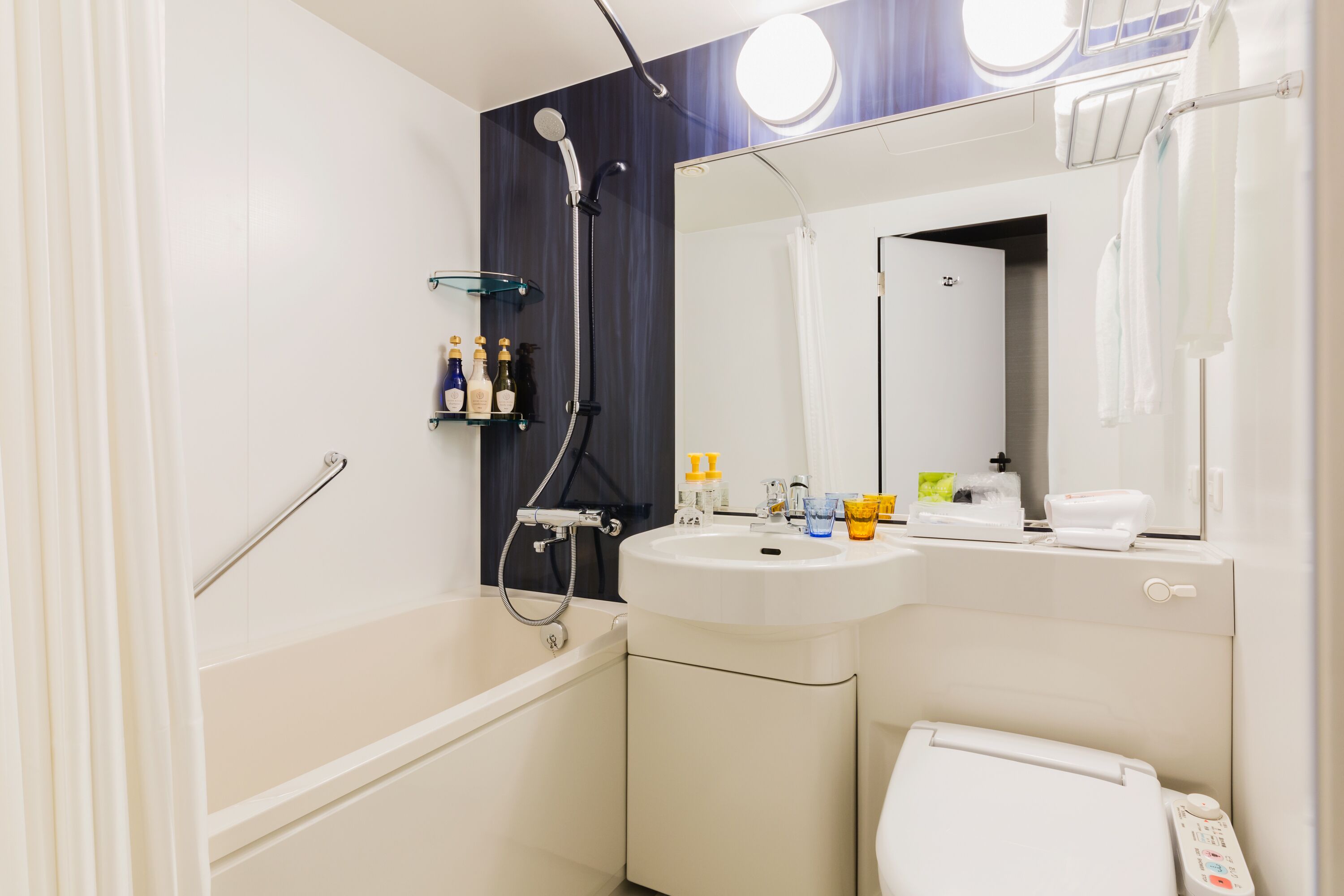 combined shower/bathtub, free toiletries, hair dryer, slippers