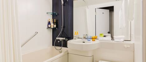 A modern bathroom with a bathtub, a sink, and a toilet. There are shelves with toiletries and a mirror above the sink.