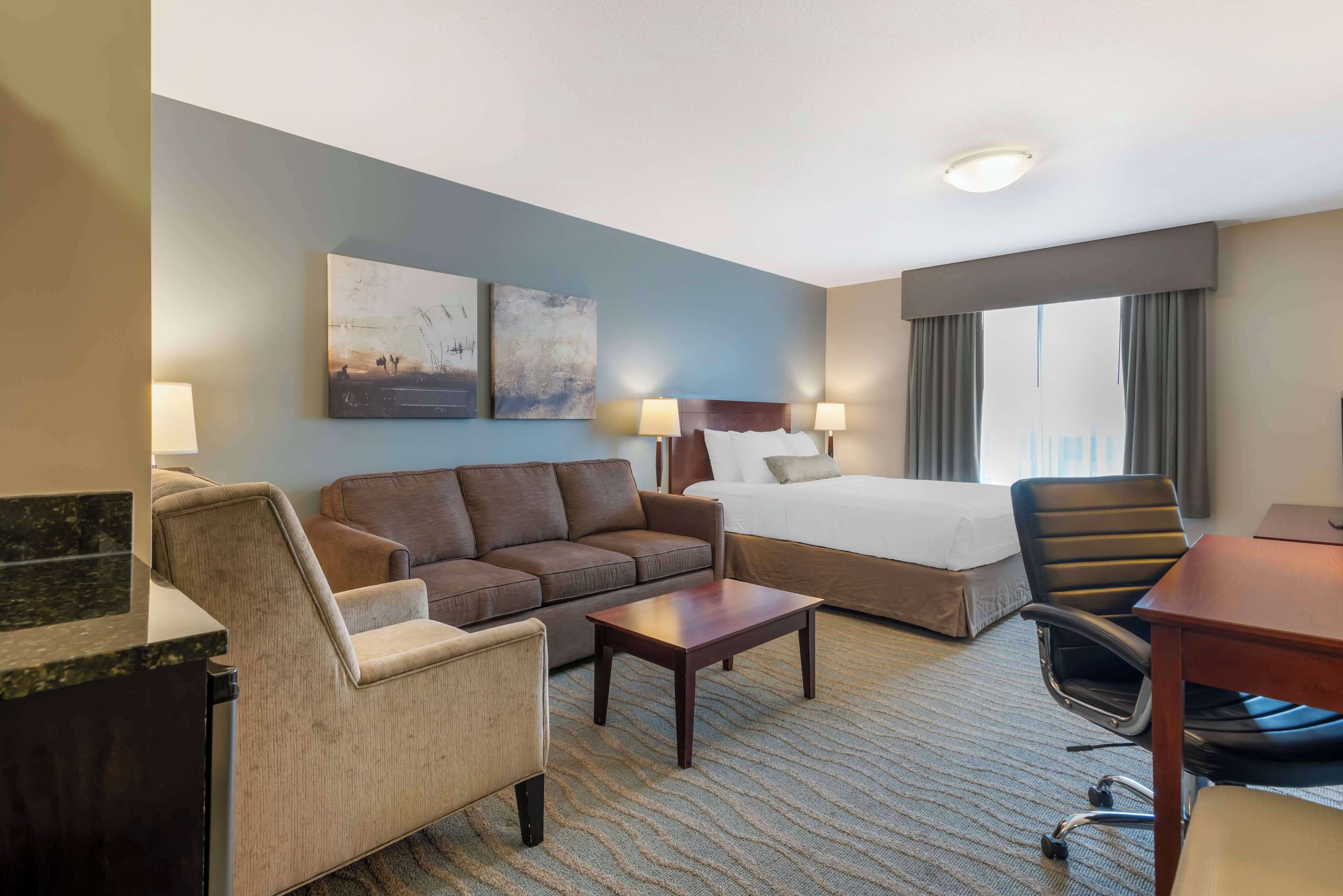 pillow-top beds, desk, laptop workspace, blackout curtains