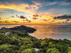 A coastal landscape with a forested area and a small island. - ECOTICA Boutique Hotel & Spa. (Quepos)