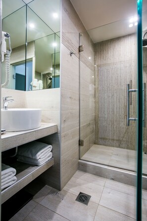 Shower, free toiletries, hair dryer, slippers