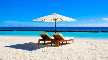 Private beach, white sand, sun-loungers, beach umbrellas