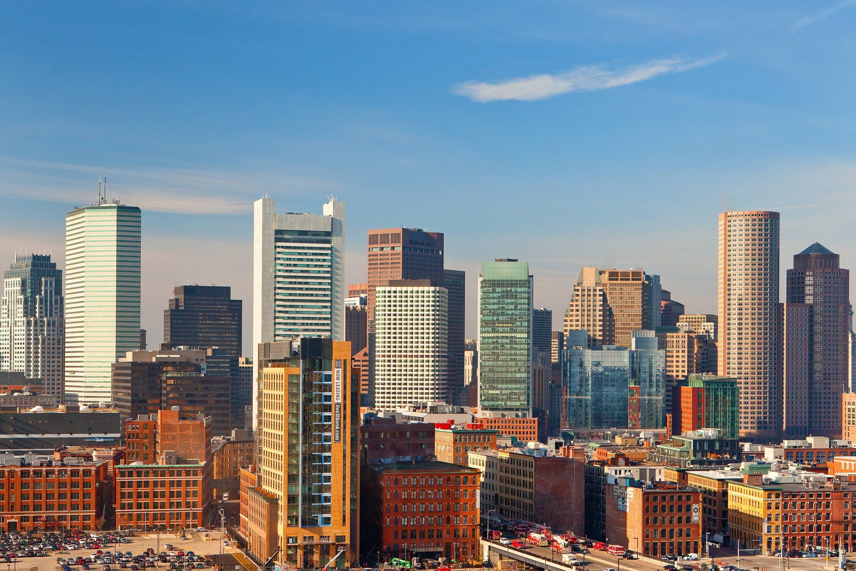 A cityscape with various buildings, including a mix of modern and older architecture.