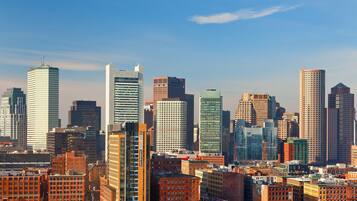 A cityscape with various buildings, including a mix of modern and older architecture.