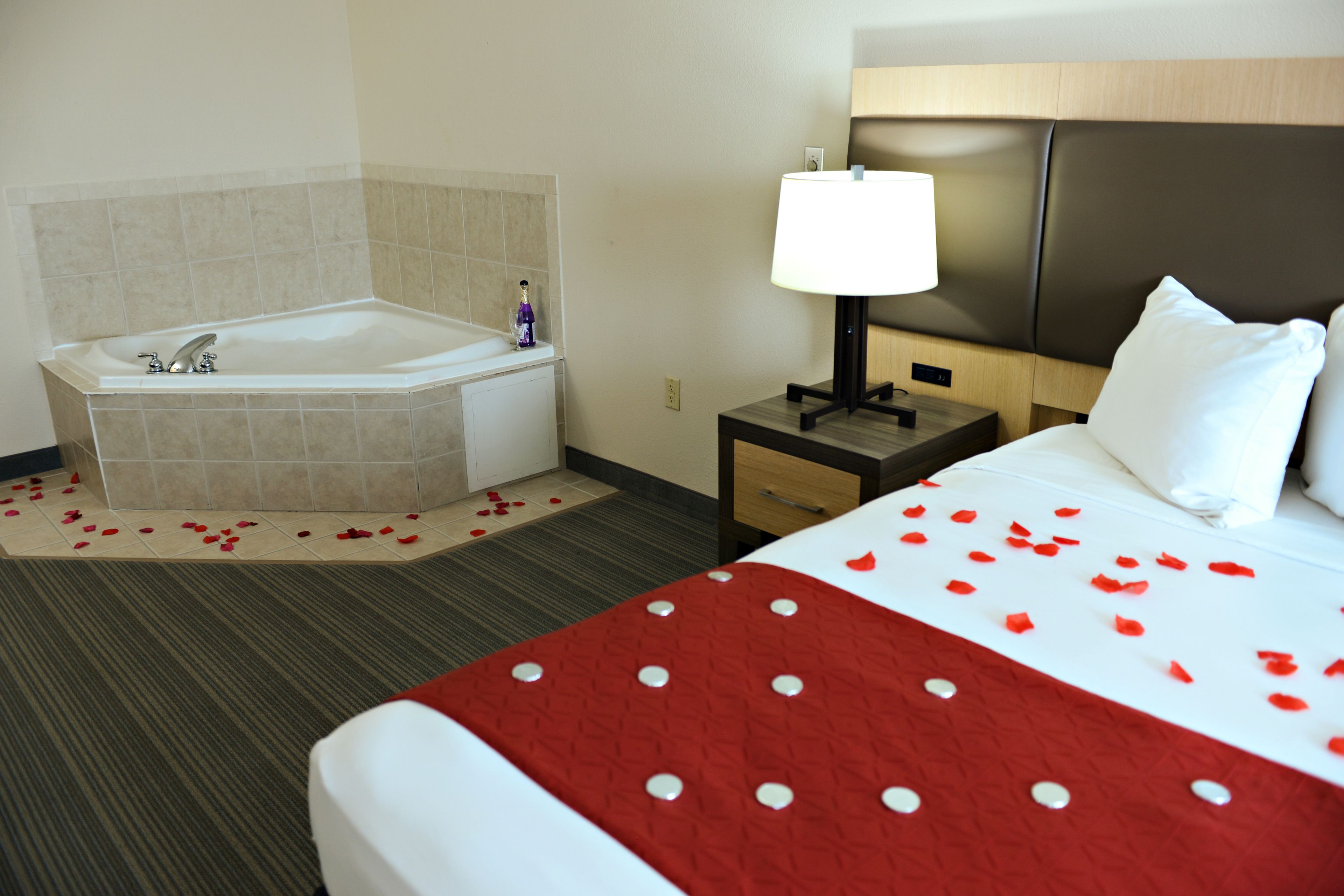 suite, 1 king bed, non smoking, jetted tub | desk, laptop workspace, iron/ironing board, free cots/infant beds