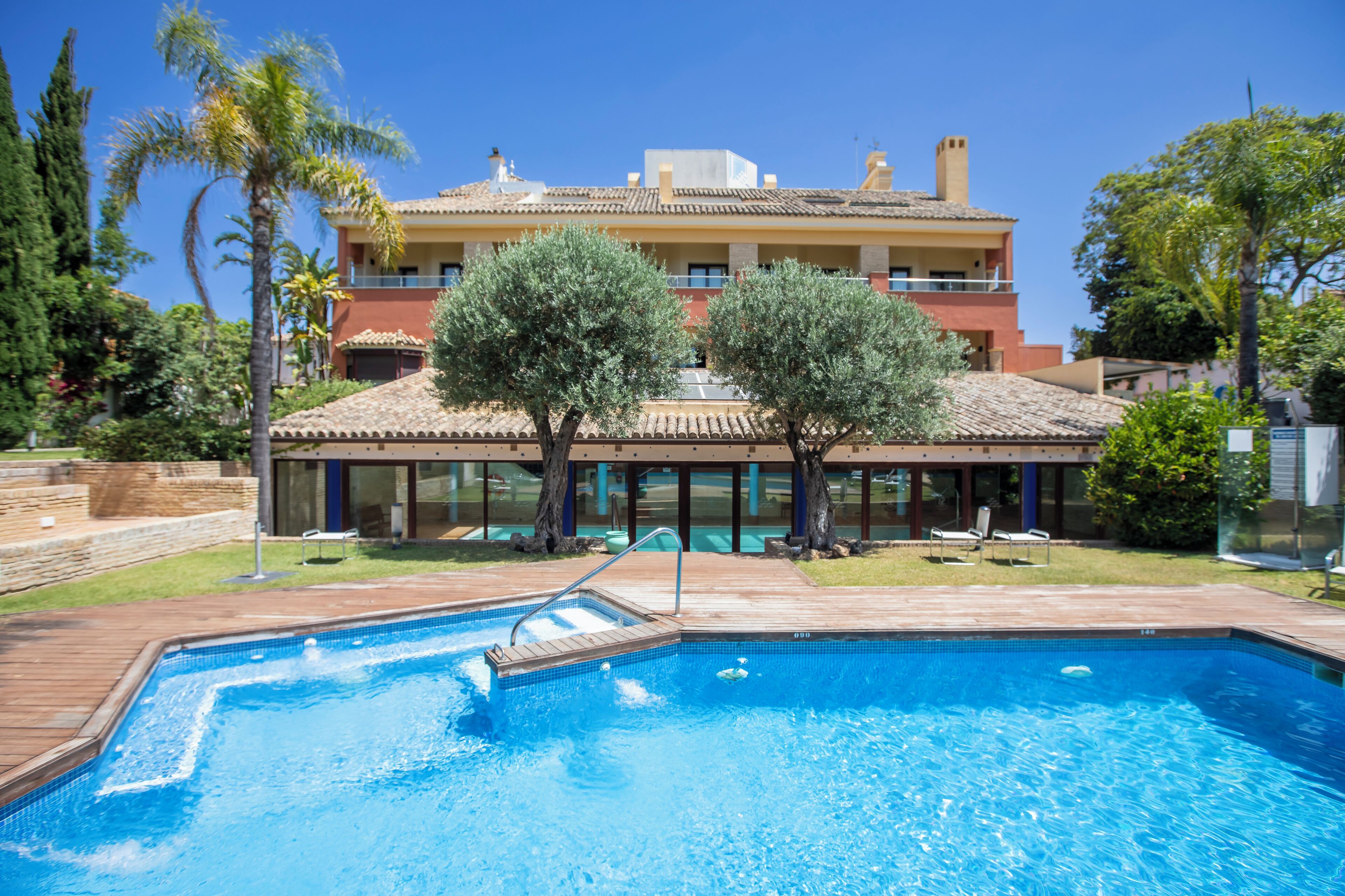 indoor pool, seasonal outdoor pool, pool umbrellas, pool loungers